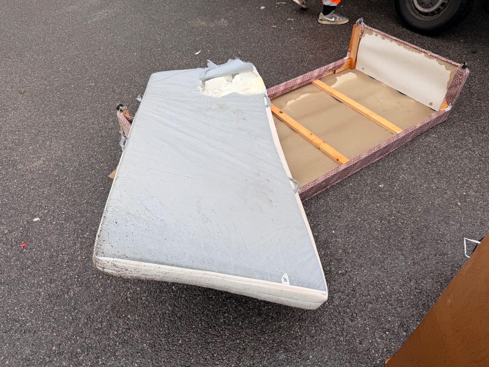 Old mattress and divan bed base loaded for collection